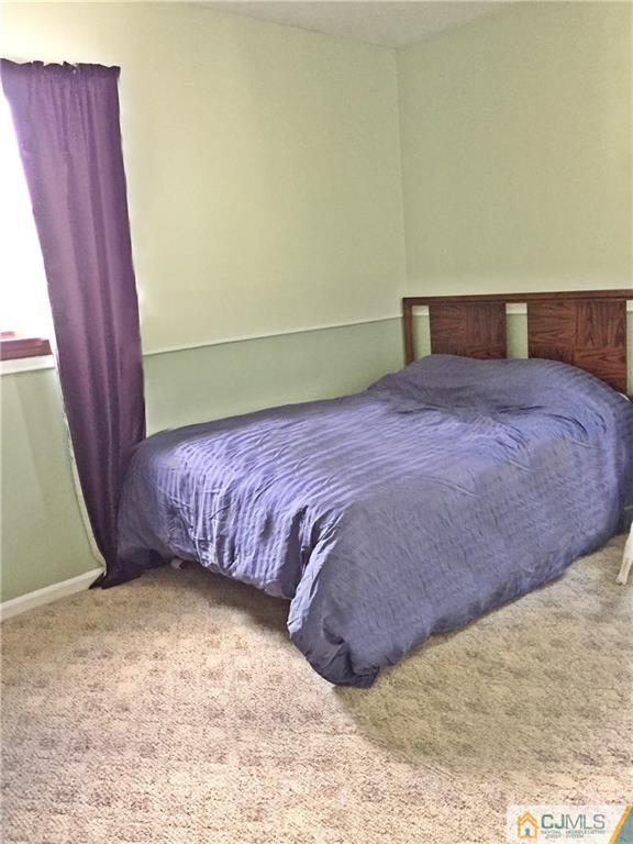 9 Sine Road Edison, NJ 08817 - Photo 12 of 21 a bedroom with a bed and a window