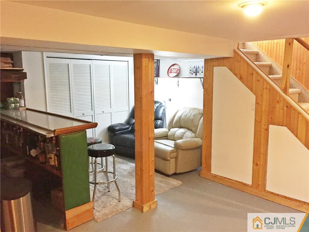 9 Sine Road Edison, NJ 08817 - Photo 17 of 21 a living room with furniture and a window
