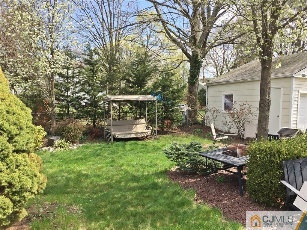 9 Sine Road Edison, NJ 08817 - Photo 19 of 21 a view of a house with backyard garden and sitting area