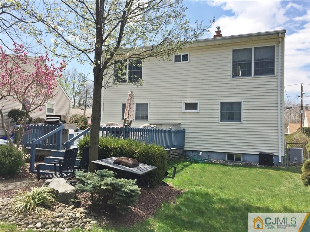 9 Sine Road Edison, NJ 08817 - Photo 20 of 21 a backyard of a house with lots of green space