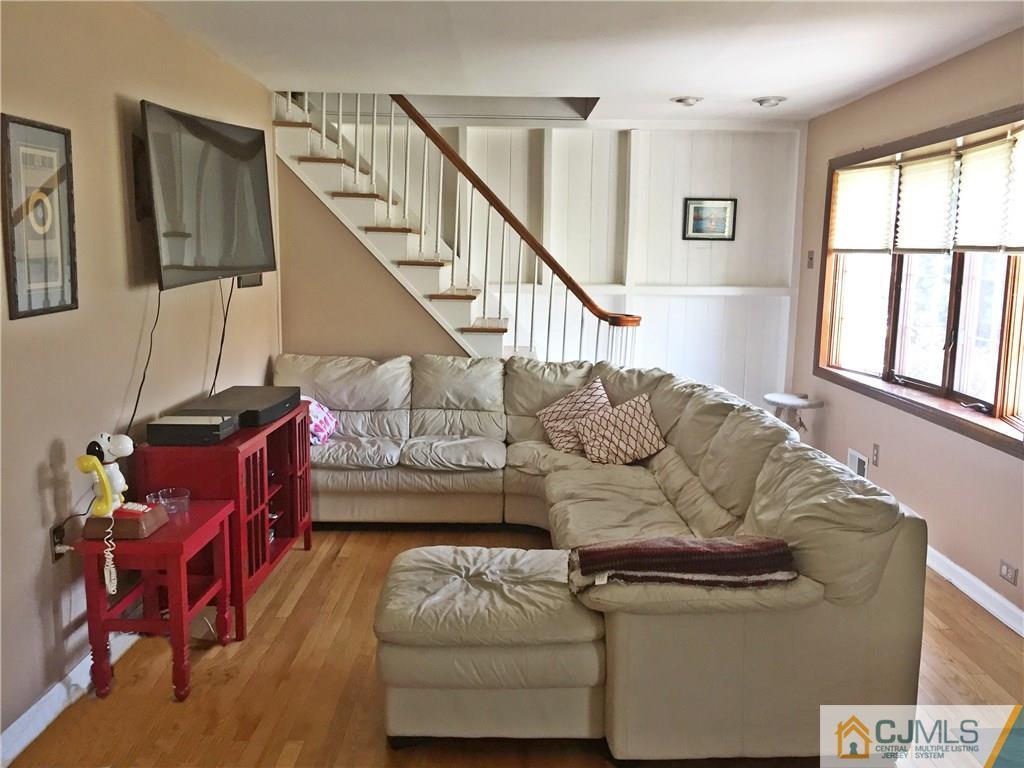 9 Sine Road Edison, NJ 08817 - Photo 5 of 21 a living room with furniture and a window