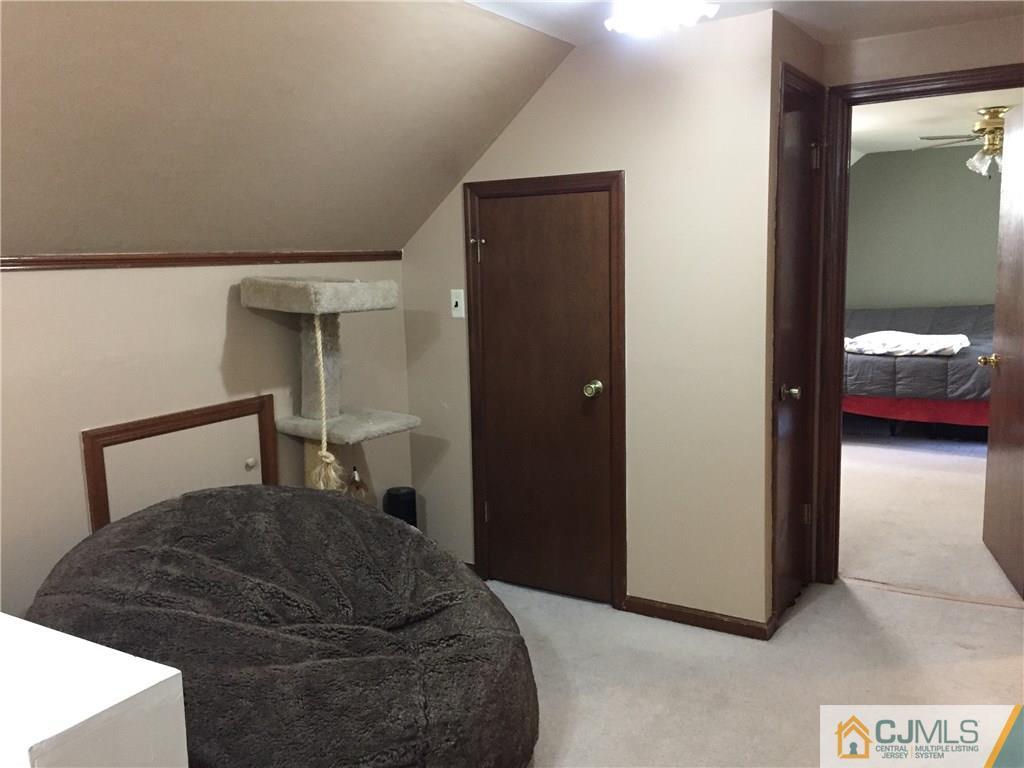 9 Sine Road Edison, NJ 08817 - Photo 10 of 21 a bedroom with a bed and a view of bathroom