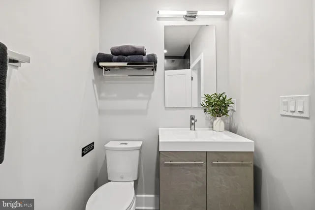 a bathroom with a shower and a sink