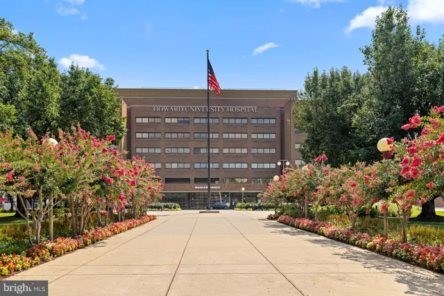 a view of a building with sitting area