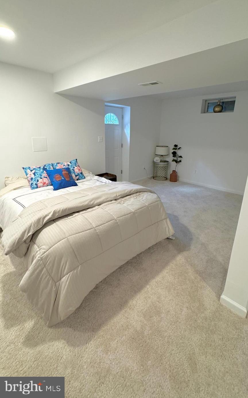 14660 Red House Road Gainesville, VA 20155 - Photo 16 of 20 a bedroom with a bed and dresser