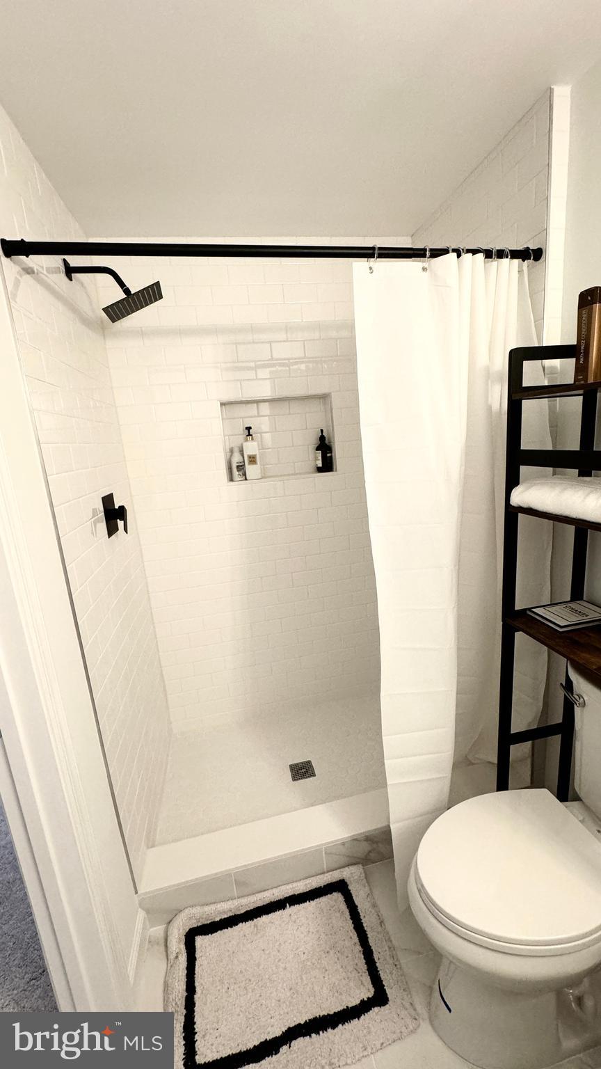 14660 Red House Road Gainesville, VA 20155 - Photo 18 of 20 a bathroom with a toilet and a shower