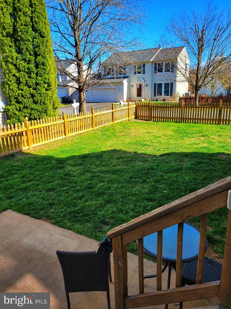 14660 Red House Road Gainesville, VA 20155 - Photo 19 of 20 a view of a house with a yard