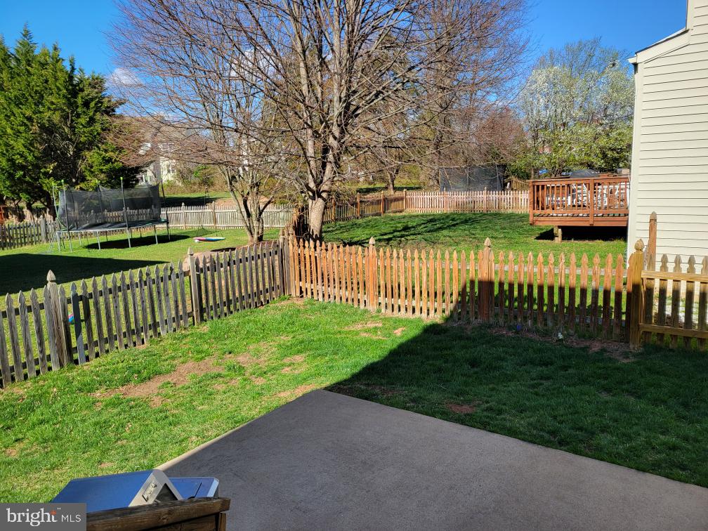 14660 Red House Road Gainesville, VA 20155 - Photo 20 of 20 a view of a street with a small yard and large trees