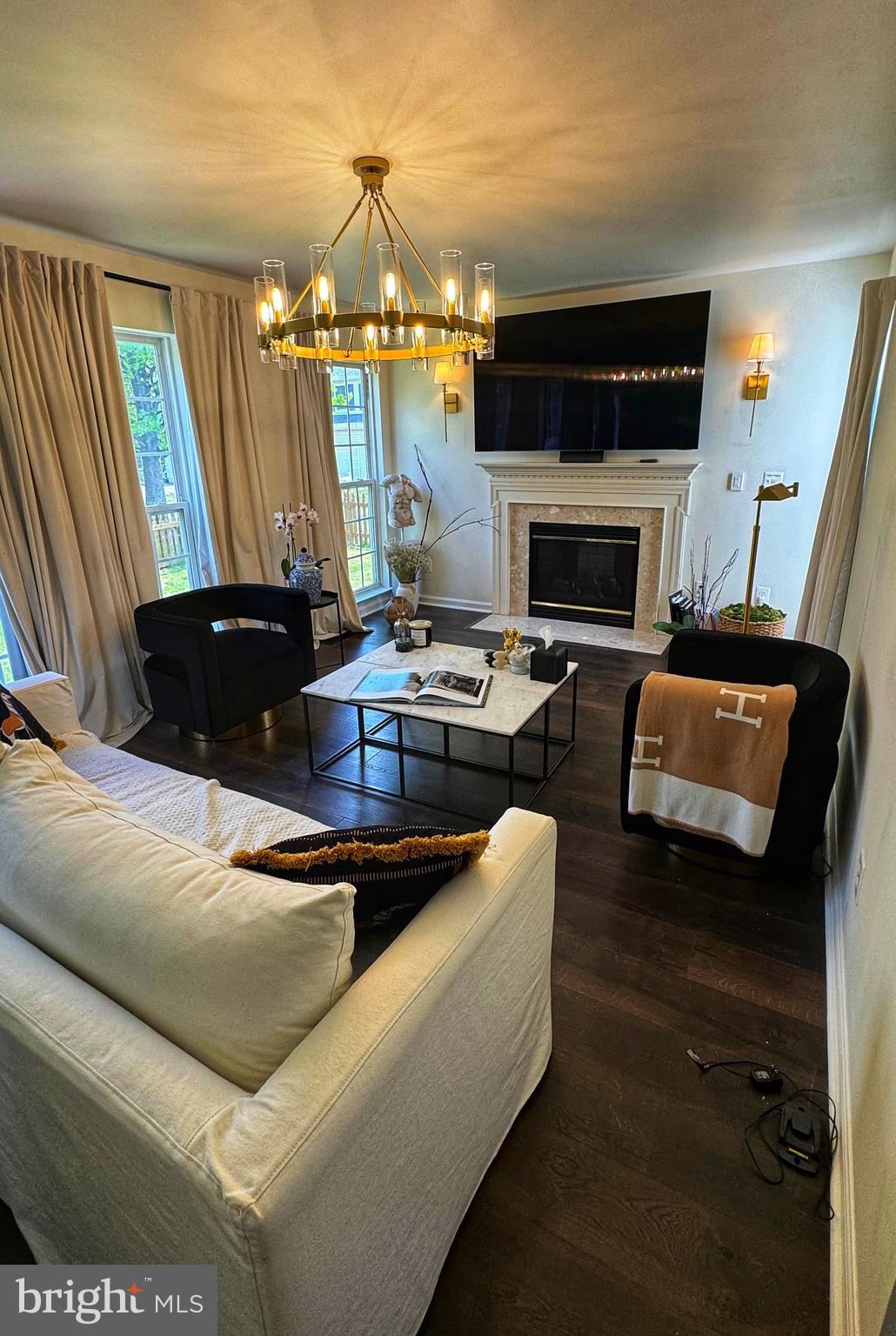 14660 Red House Road Gainesville, VA 20155 - Photo 3 of 20 a living room with furniture a fireplace and a flat screen tv