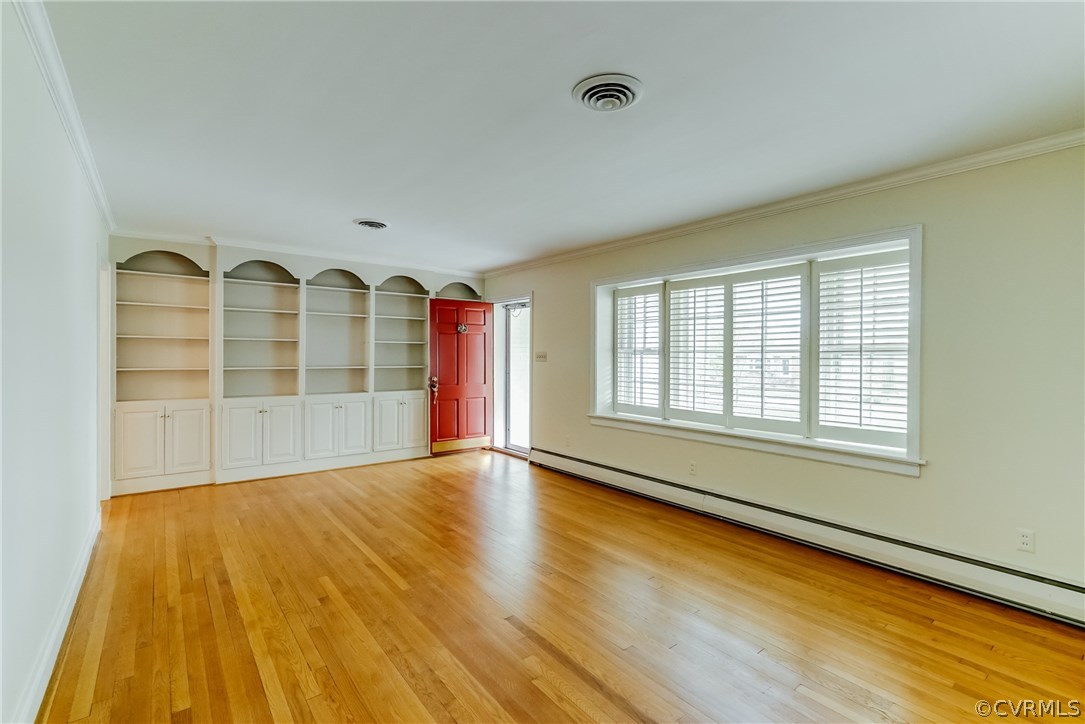 9315 Newhall Road Henrico, VA 23229 - Photo 4 of 18 Living room has pretty hardwood floors, built-in b