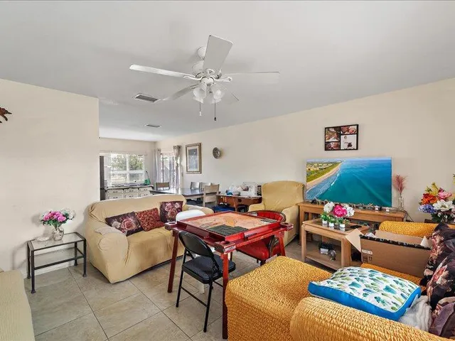 a bedroom with furniture and a chair