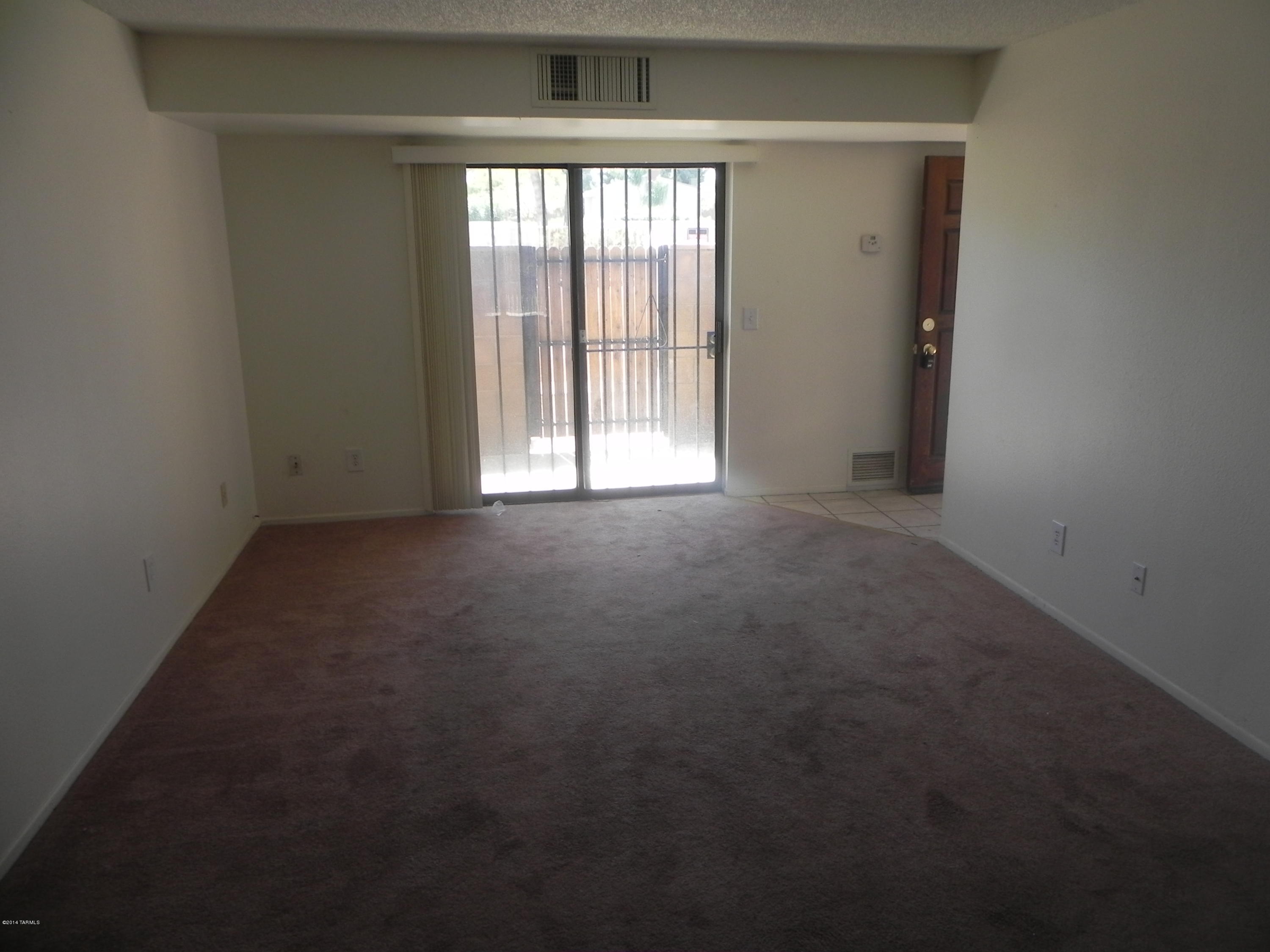 6625 East Golf Links Road, Unit 2 Tucson, AZ 85730 - Photo 4 of 14 a view of empty room with window