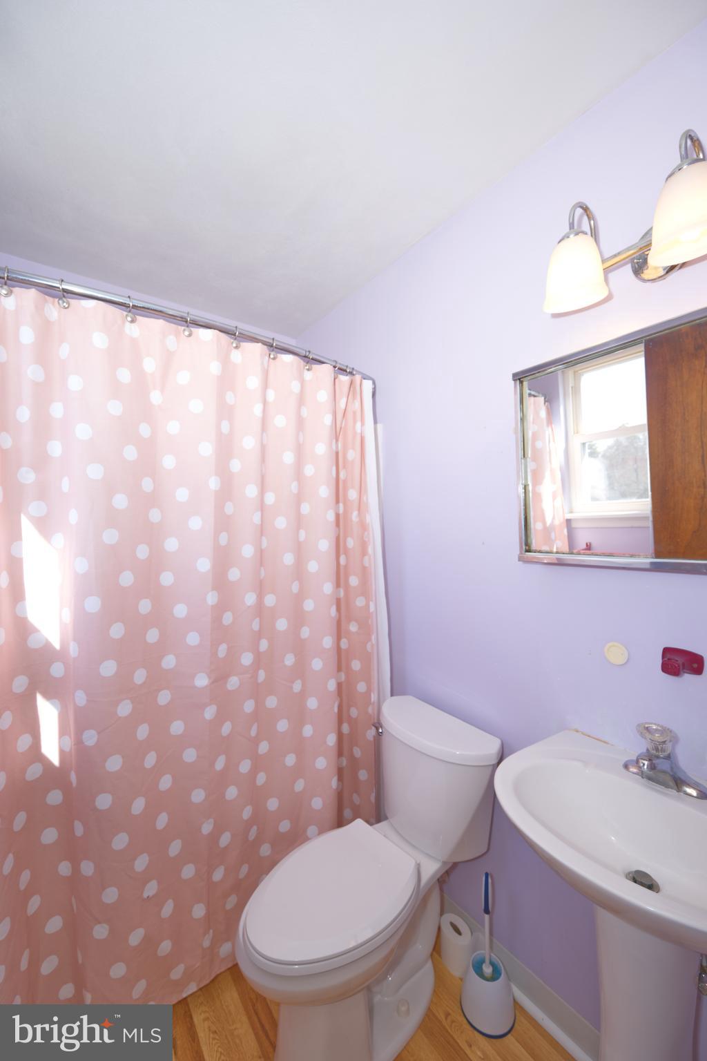 843 Townsend Boulevard Dover, DE 19901 - Photo 34 of 35 a white toilet sitting next to a bathroom sink