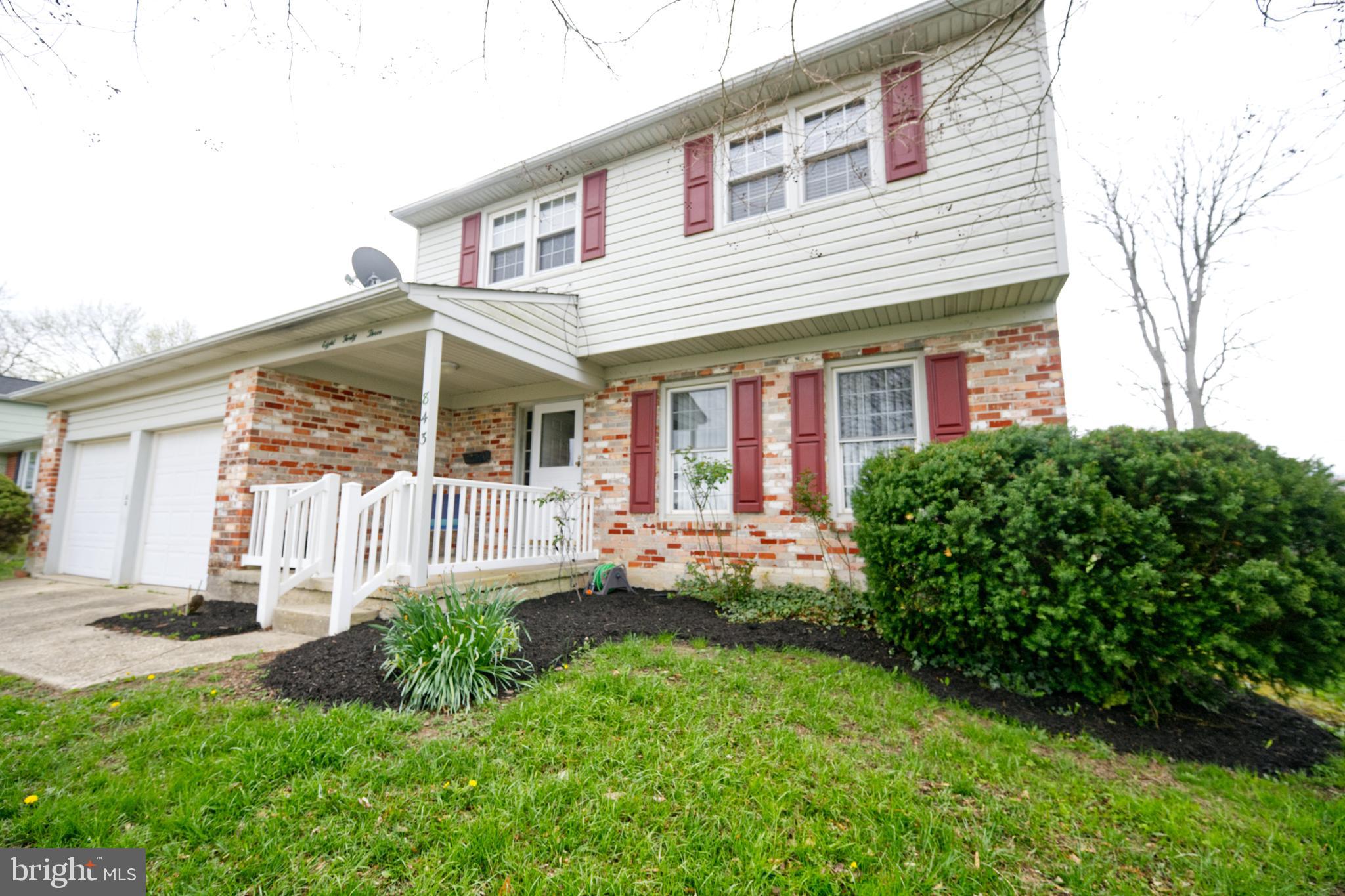 843 Townsend Boulevard Dover, DE 19901 - Photo 4 of 35 a front view of a house with a yard and porch