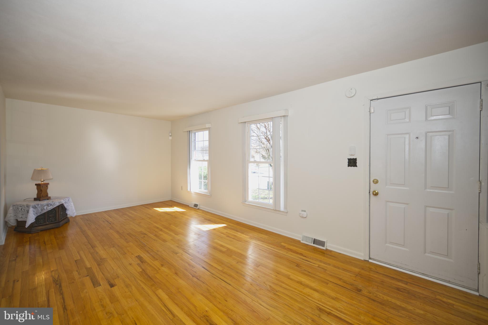 843 Townsend Boulevard Dover, DE 19901 - Photo 9 of 35 a view of an empty room with wooden floor and a window