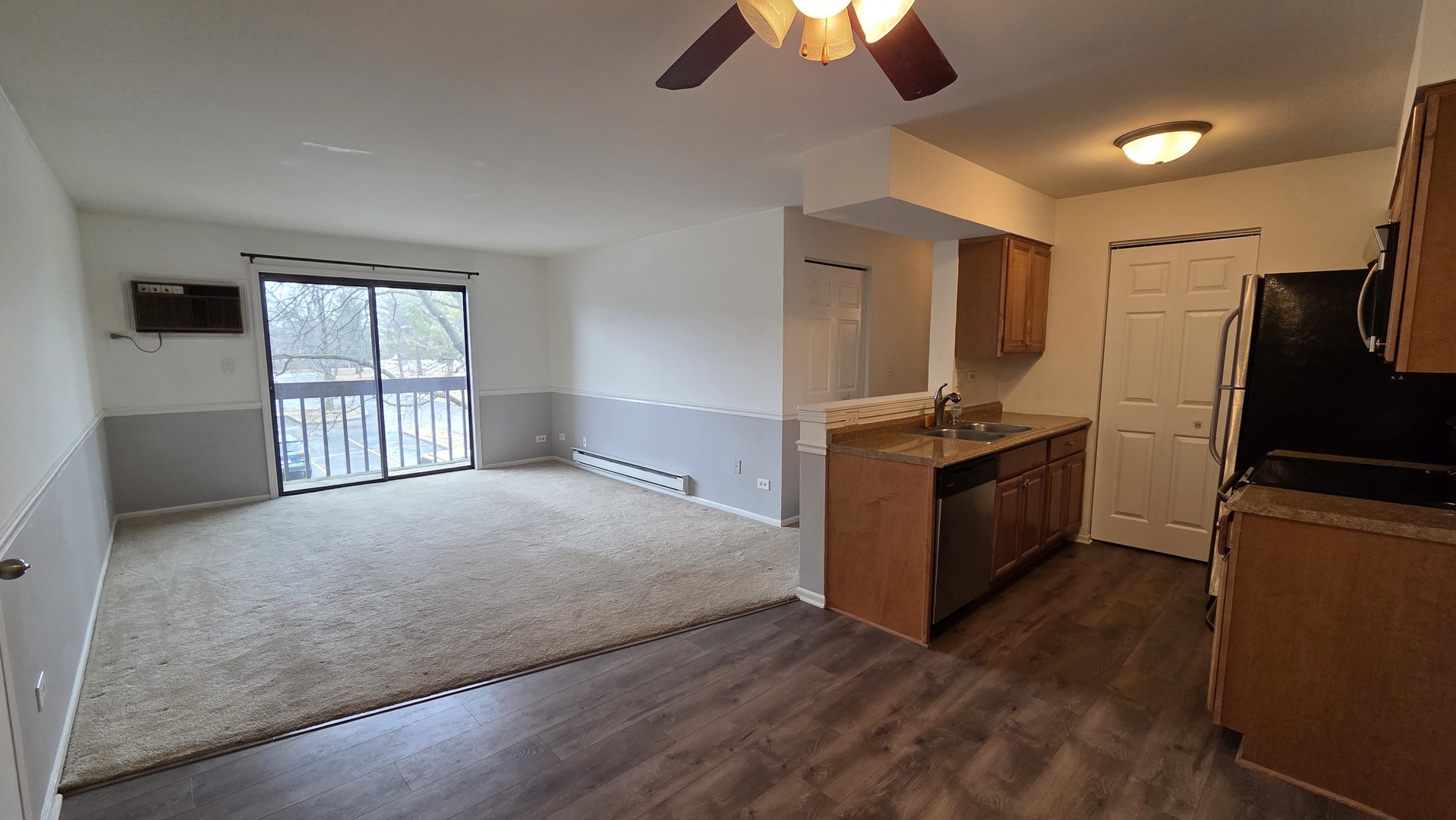 627 South Virginia Road, Unit 212 Crystal Lake, IL 60014 - Photo 5 of 15 a kitchen with stainless steel appliances granite countertop a stove and a refrigerator