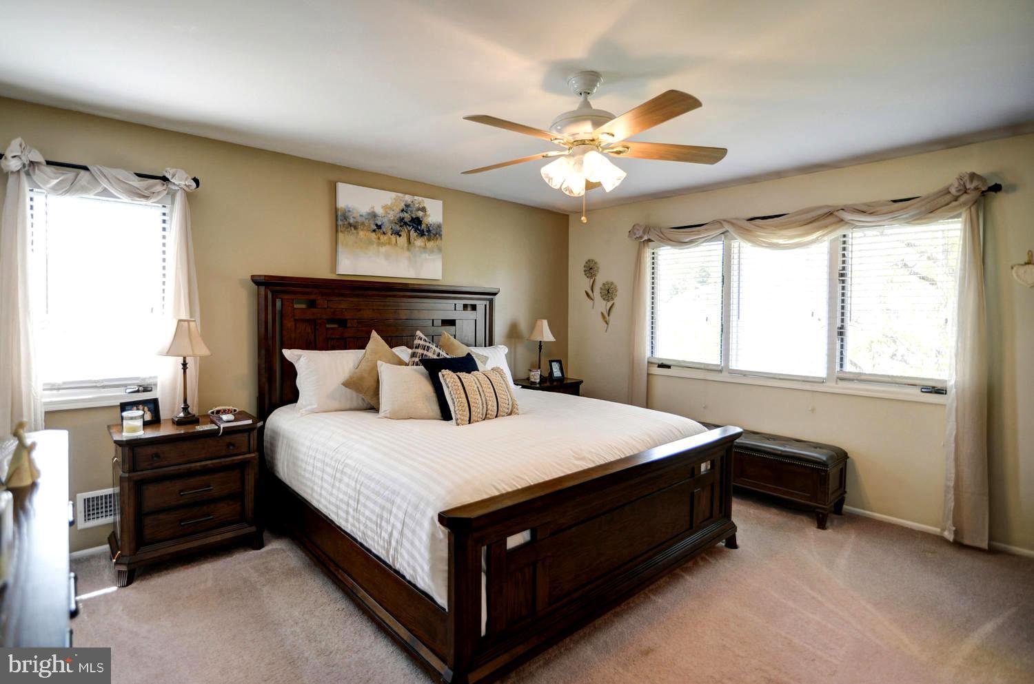 11 John Lenhardt Road Hamilton, NJ 08690 - Photo 14 of 24 a bed sitting in a bedroom next to a window