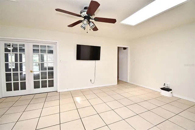 a view of a livingroom with furniture and a flat screen tv