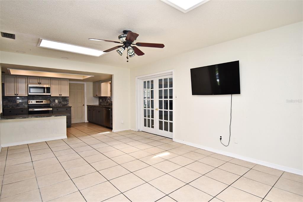 5133 Brenda Drive Orlando, FL 32812 - Photo 16 of 51 a view of a livingroom with furniture and a flat screen tv
