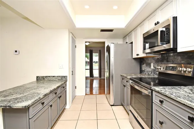 a bathroom with a sink a toilet and vanity