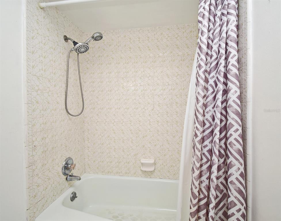 5133 Brenda Drive Orlando, FL 32812 - Photo 27 of 51 a bathroom with a bath tub