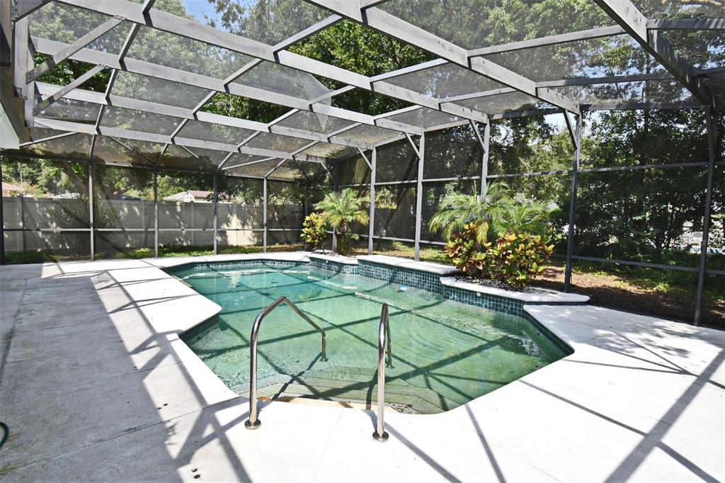 5133 Brenda Drive Orlando, FL 32812 - Photo 46 of 51 a patio with a yard table and chairs