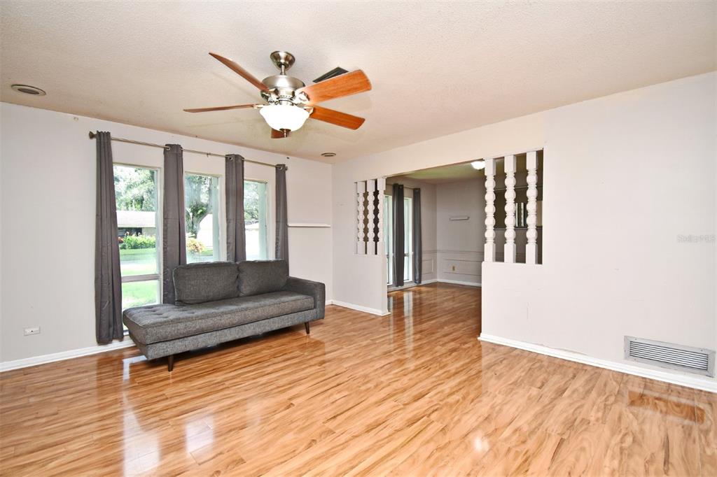 5133 Brenda Drive Orlando, FL 32812 - Photo 9 of 51 a living room with furniture and a wooden floor