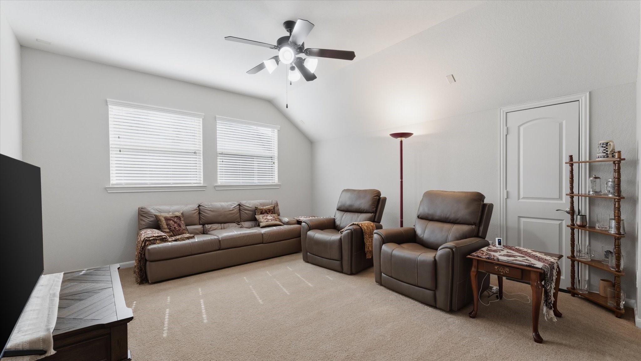 14 Painted Post Place Spring, TX 77389 - Photo 25 of 43 a living room with furniture a ceiling fan and a window