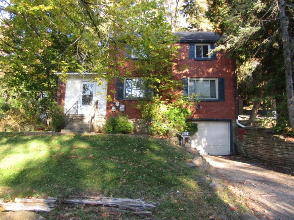 8601 Westwood Road Pittsburgh, PA 15235 - Photo 1 of 28 a front view of a house with a yard