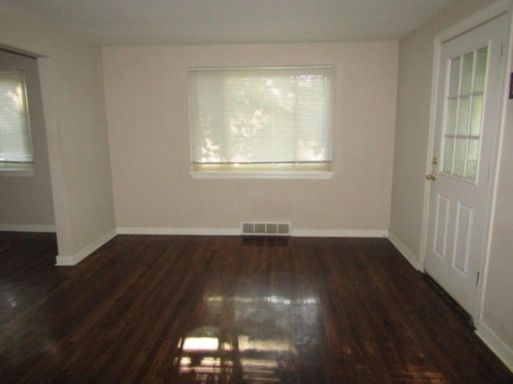 8601 Westwood Road Pittsburgh, PA 15235 - Photo 11 of 28 an empty room with wooden floor and windows