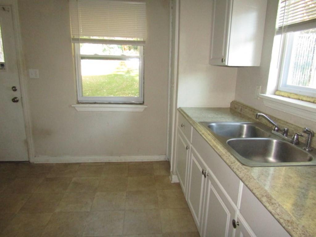 8601 Westwood Road Pittsburgh, PA 15235 - Photo 15 of 28 a kitchen with a sink and washing machine