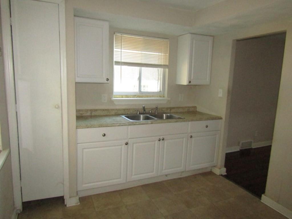 8601 Westwood Road Pittsburgh, PA 15235 - Photo 17 of 28 a bathroom with a granite countertop sink and window