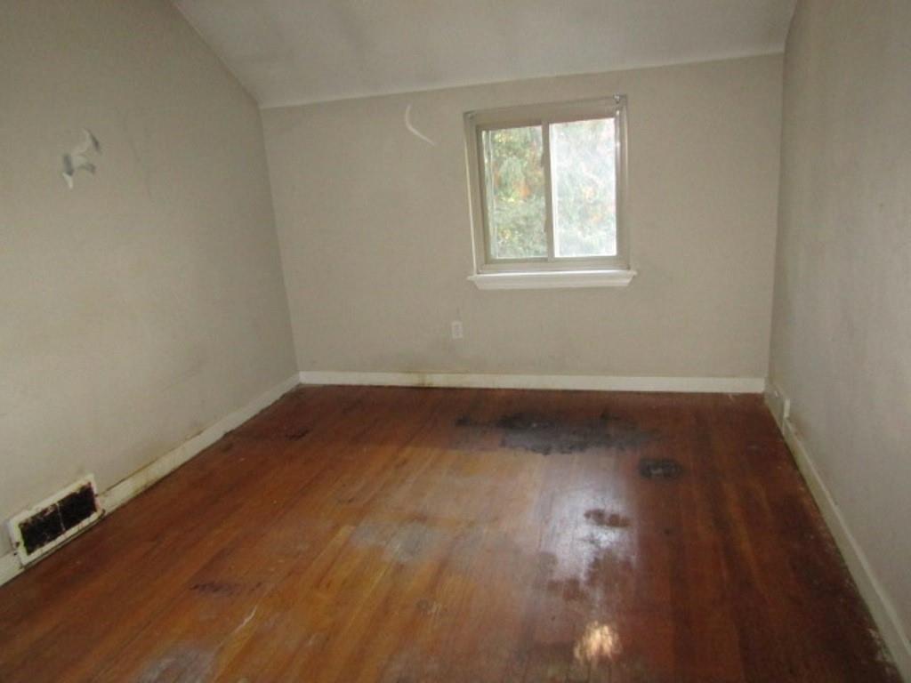 8601 Westwood Road Pittsburgh, PA 15235 - Photo 19 of 28 an empty room with wooden floor and windows