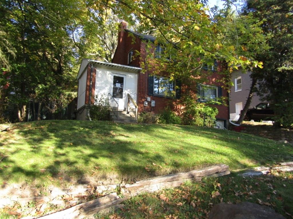 8601 Westwood Road Pittsburgh, PA 15235 - Photo 2 of 28 a front view of house with garden