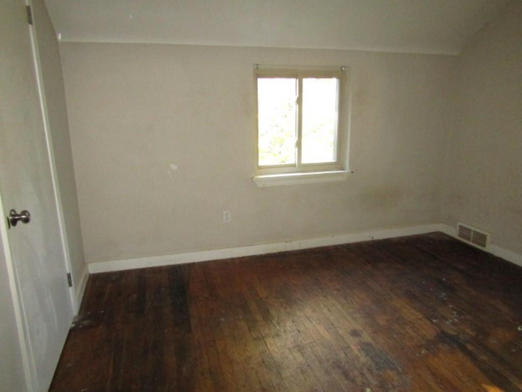 8601 Westwood Road Pittsburgh, PA 15235 - Photo 24 of 28 an empty room with wooden floor and windows