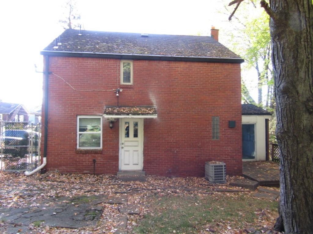 8601 Westwood Road Pittsburgh, PA 15235 - Photo 4 of 28 a front view of a house with a yard