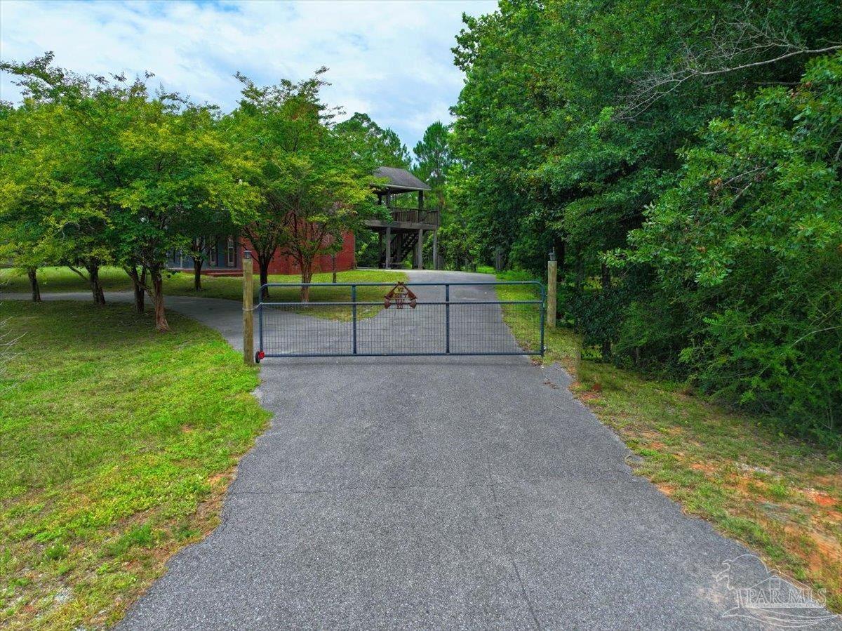 2099 Garcon Point Road Milton, FL 32583 - Photo 16 of 65 a view of a park with trees