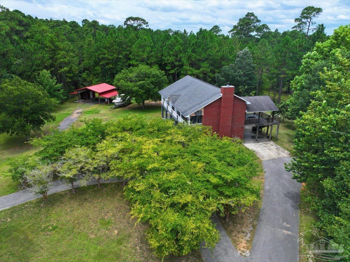 2099 Garcon Point Road Milton, FL 32583 - Photo 17 of 65 a view of a house with a yard