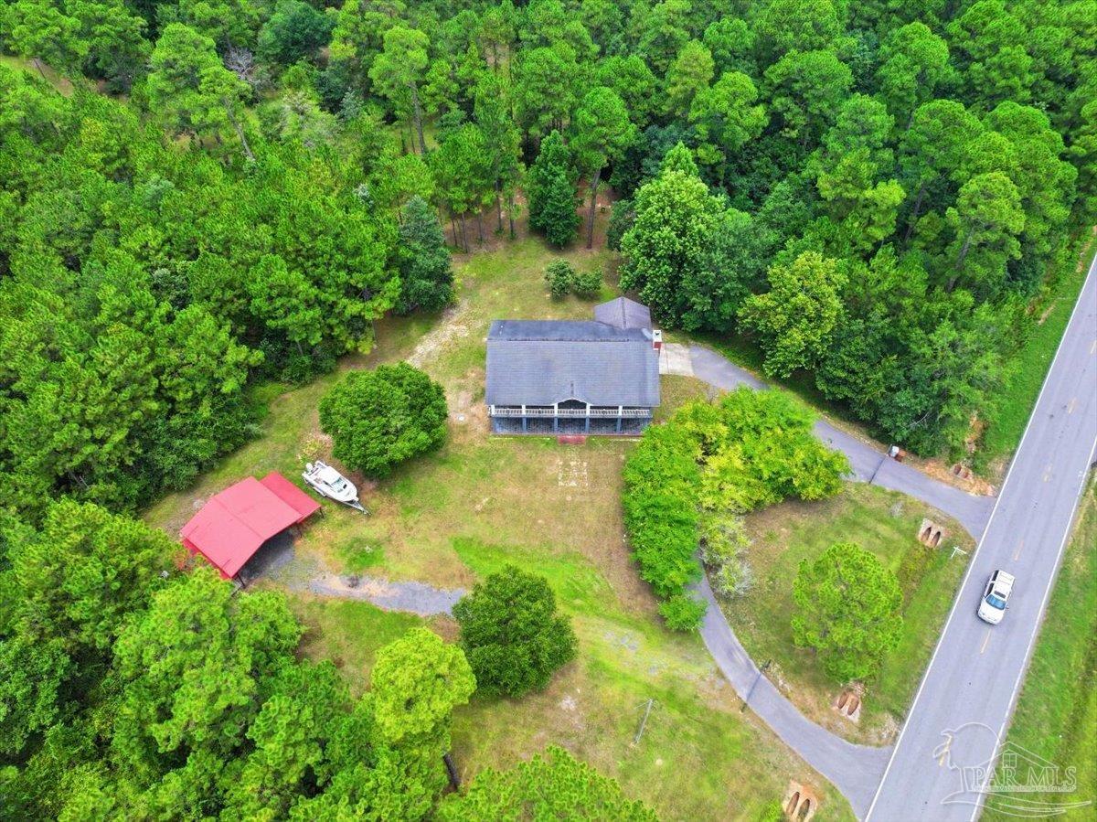 2099 Garcon Point Road Milton, FL 32583 - Photo 19 of 65 an aerial view of a house with a yard
