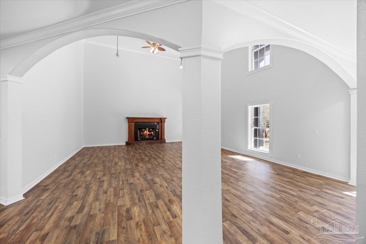 2099 Garcon Point Road Milton, FL 32583 - Photo 32 of 65 a view of empty room with wooden floor