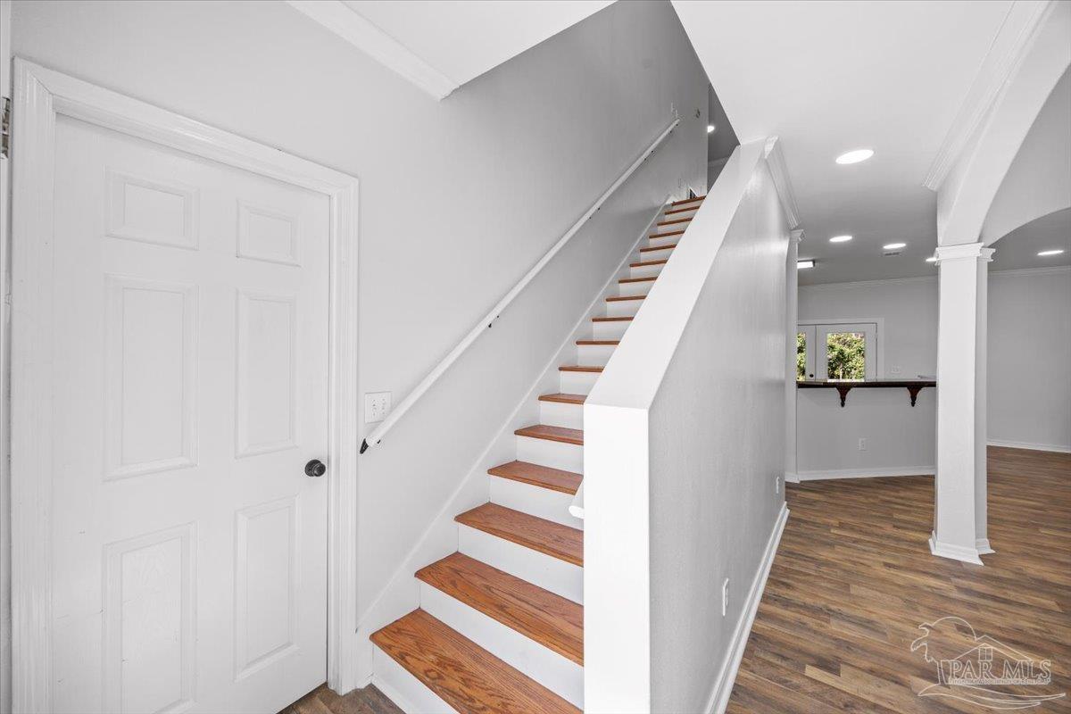 2099 Garcon Point Road Milton, FL 32583 - Photo 37 of 65 a view of a hallway with wooden floor and entryway
