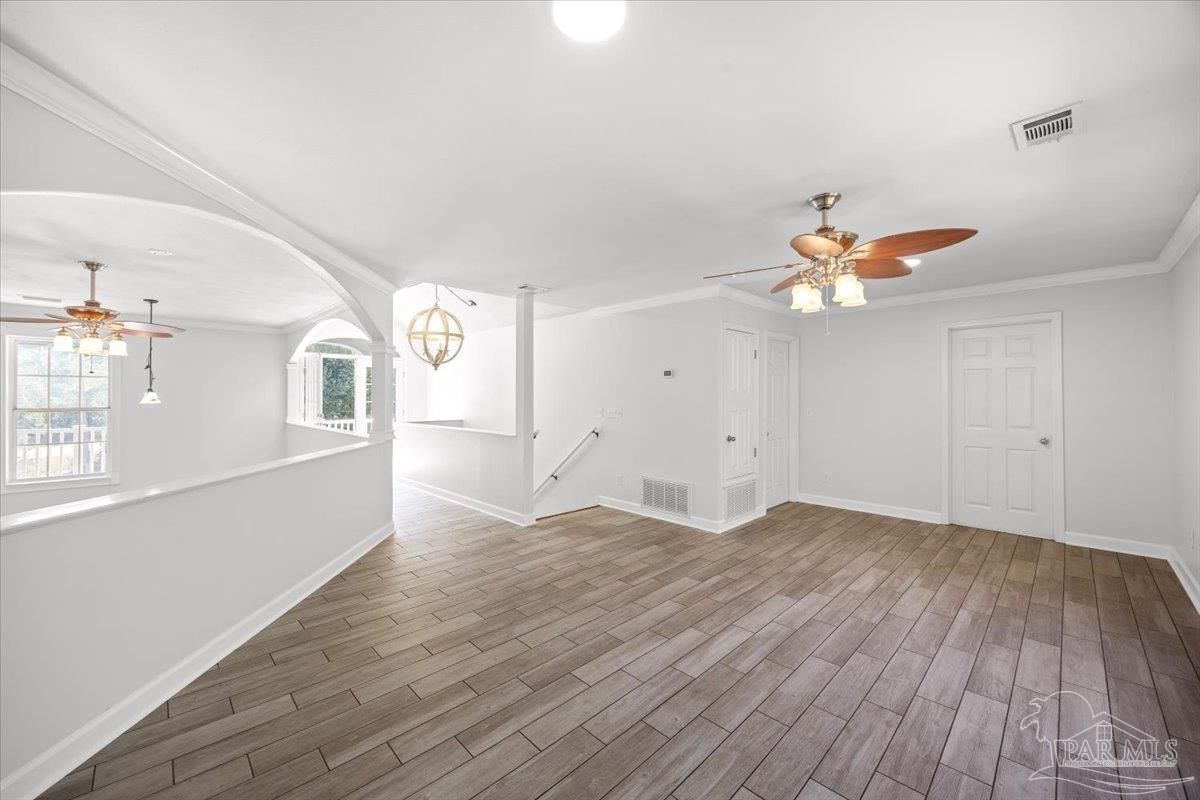 2099 Garcon Point Road Milton, FL 32583 - Photo 41 of 65 a view of empty room with wooden floor