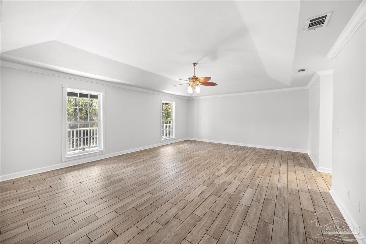 2099 Garcon Point Road Milton, FL 32583 - Photo 45 of 65 wooden floor in an empty room with a window
