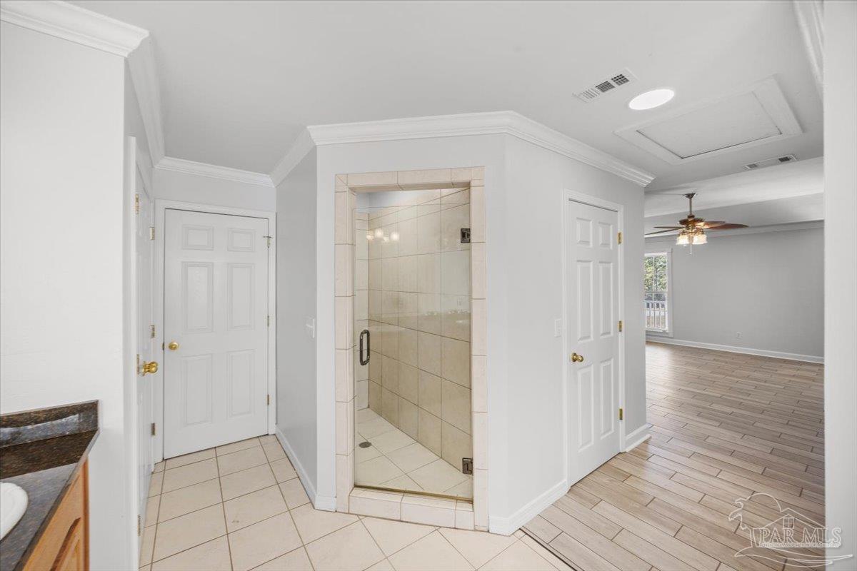 2099 Garcon Point Road Milton, FL 32583 - Photo 49 of 65 a bathroom with a shower and a glass door