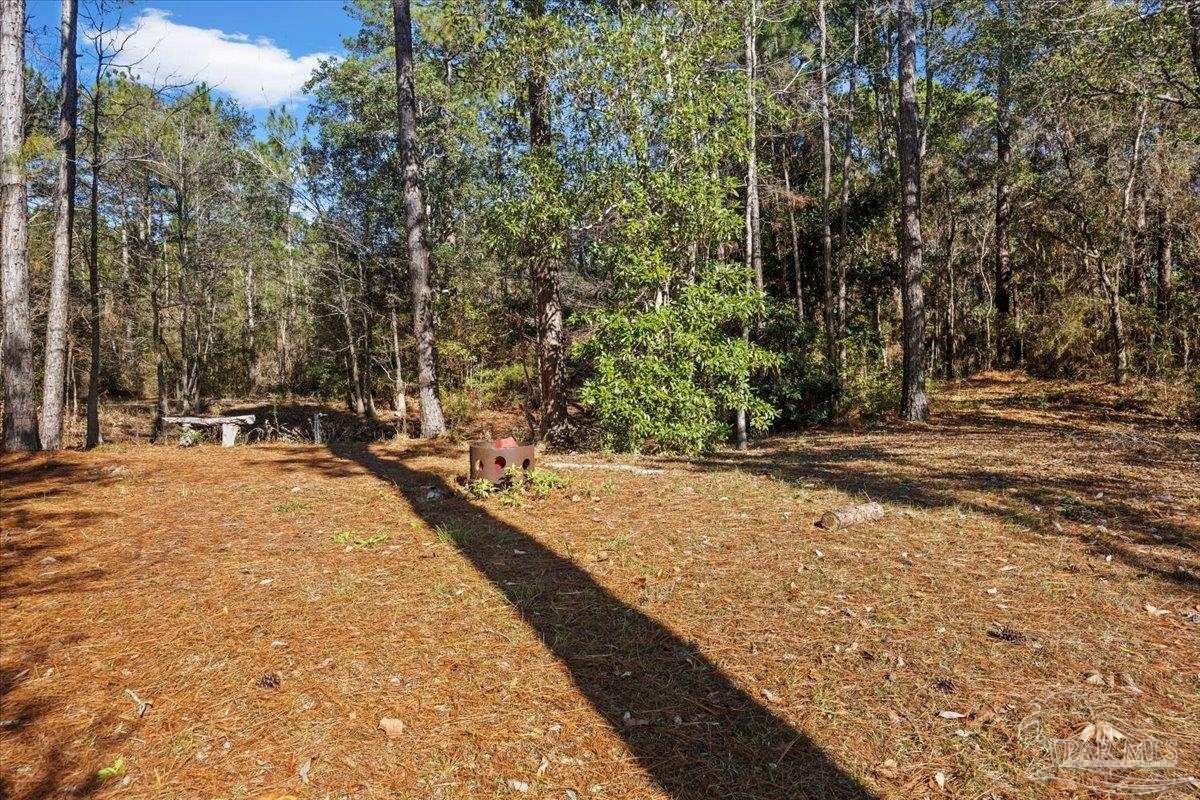 2099 Garcon Point Road Milton, FL 32583 - Photo 52 of 65 a view of swimming pool with an outdoor space