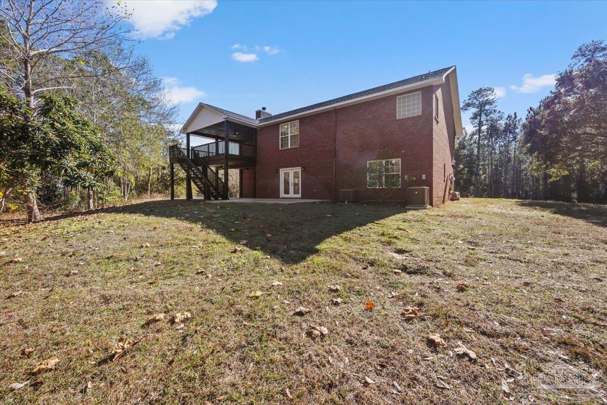 2099 Garcon Point Road Milton, FL 32583 - Photo 54 of 65 a front view of a house with a yard