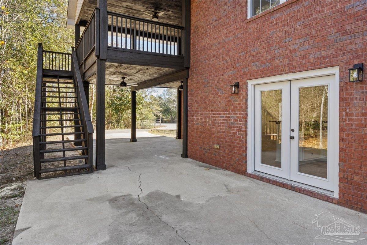 2099 Garcon Point Road Milton, FL 32583 - Photo 57 of 65 a view of a brick house with a large window