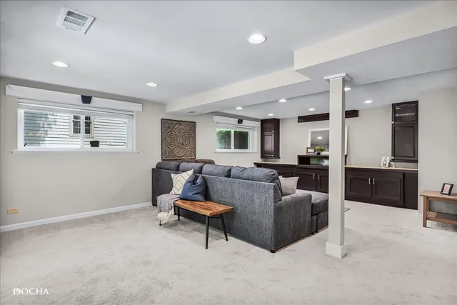 a living room with furniture and a window