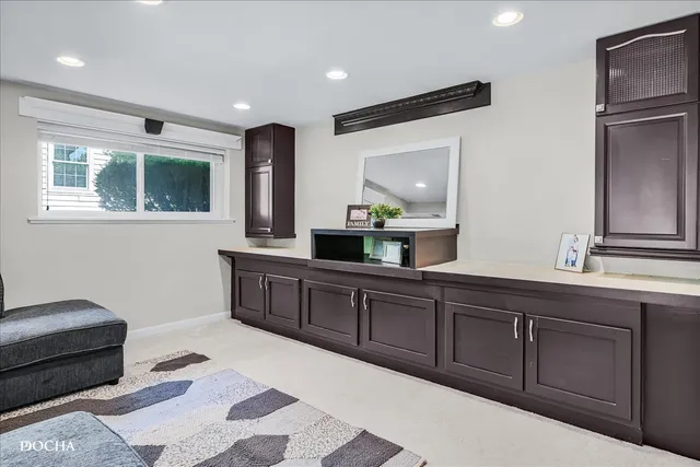 a spacious bathroom with a double vanity sink and a mirror