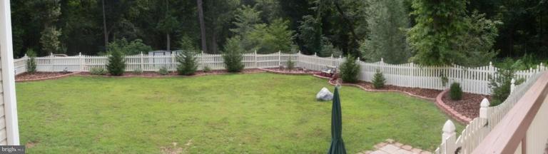 909 Wieker Road Severn, MD 21144 - Photo 26 of 30 The side yard is fenced and well landscaped.